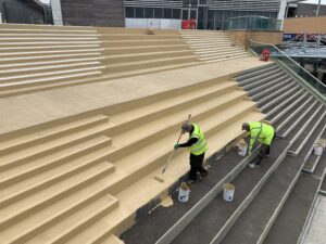 Applying Emery coating to steps of the Orbital Shopping Centre Swindon