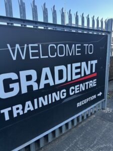 Gradient Welcome sign to the Training Centre