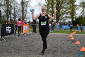 Claire completing her 10K run to the finish line
