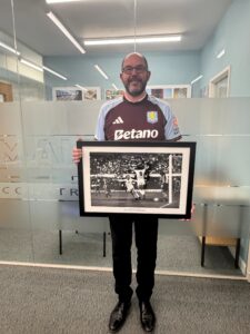 Stuart holding his Aston Villa photo of winning goal of European Cup in 1982 final